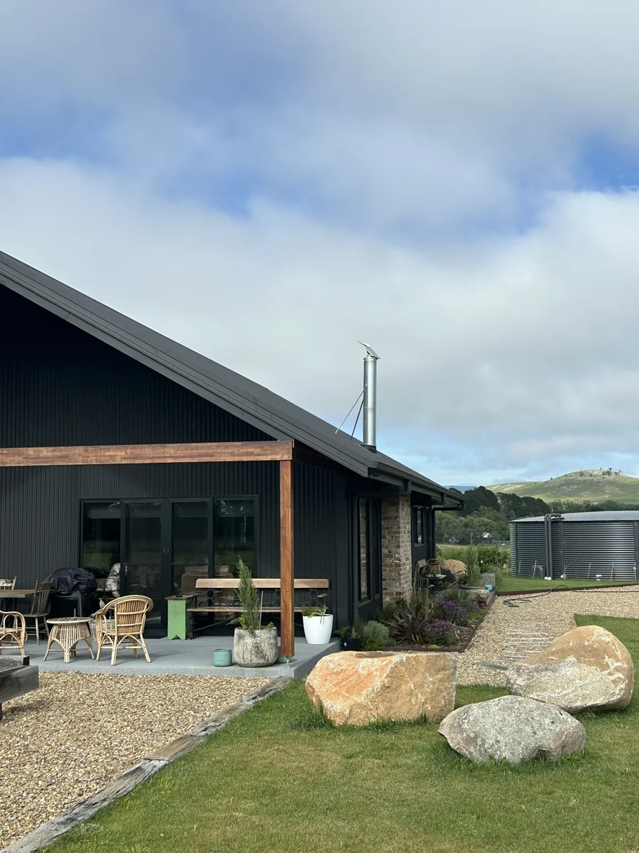 Boulders, lawn and garden beds