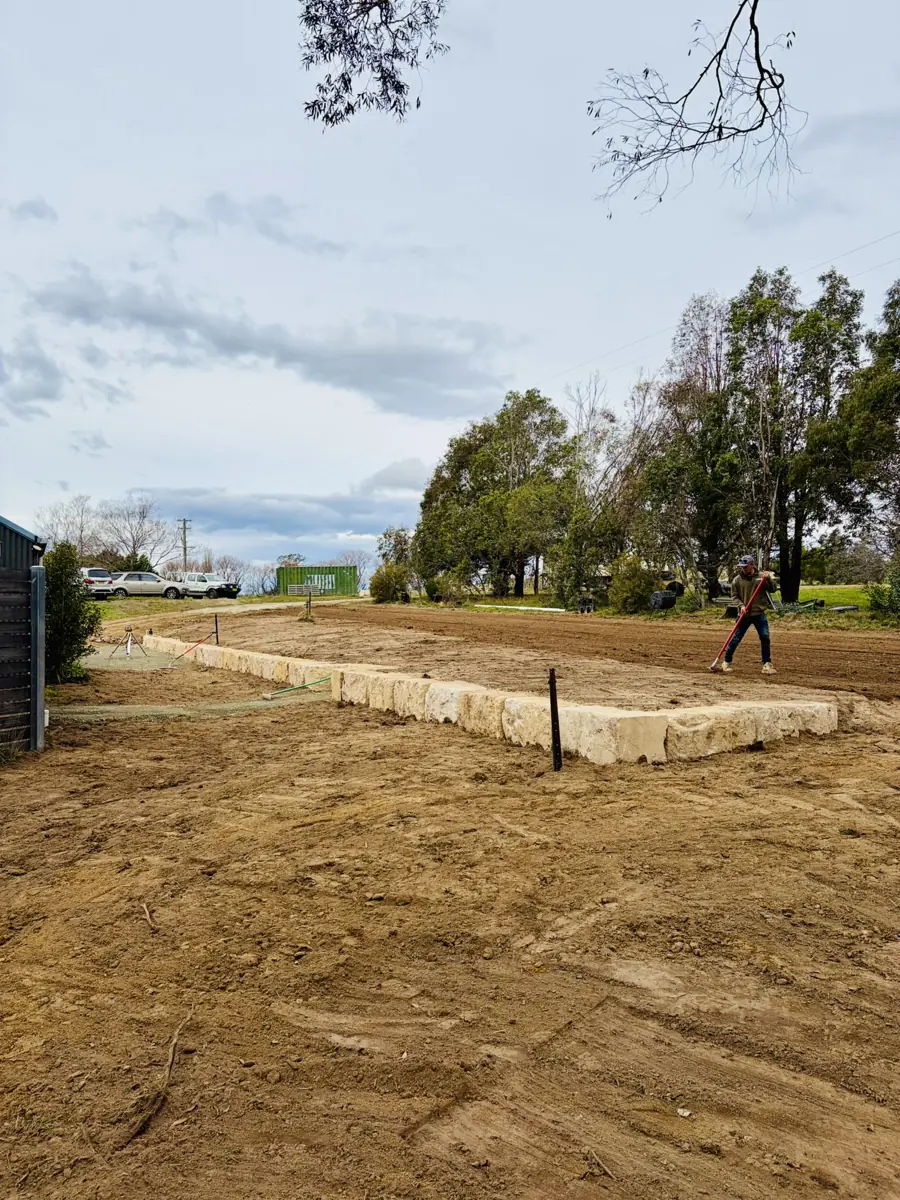 Site levelling and sandstone retaining wall